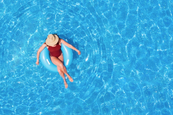 Leslie's Pool Supplies woman in a tube in a pool