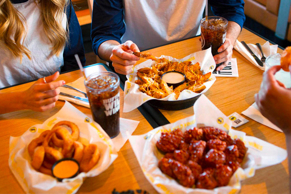people enjoying snacks at buffalo wild wings