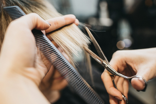 lady cutting hairs