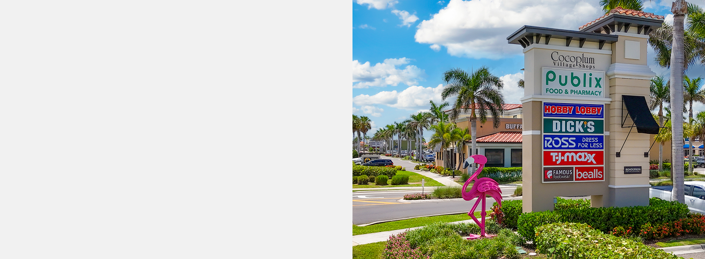 Cocoplum Village Shops signage with flamingo sculpture